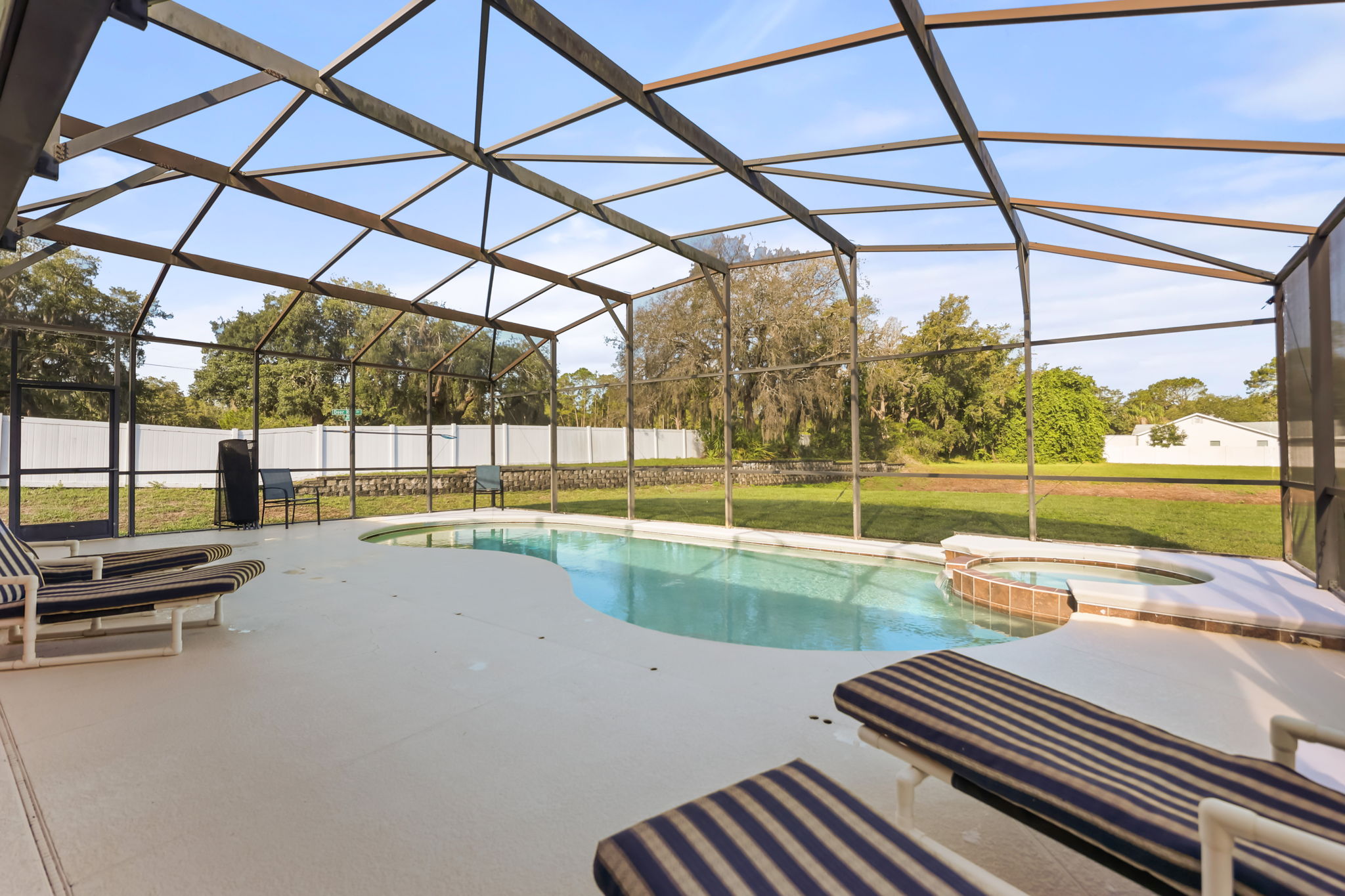 Private screened pool and heated spa at 183 Tiger Lily Court